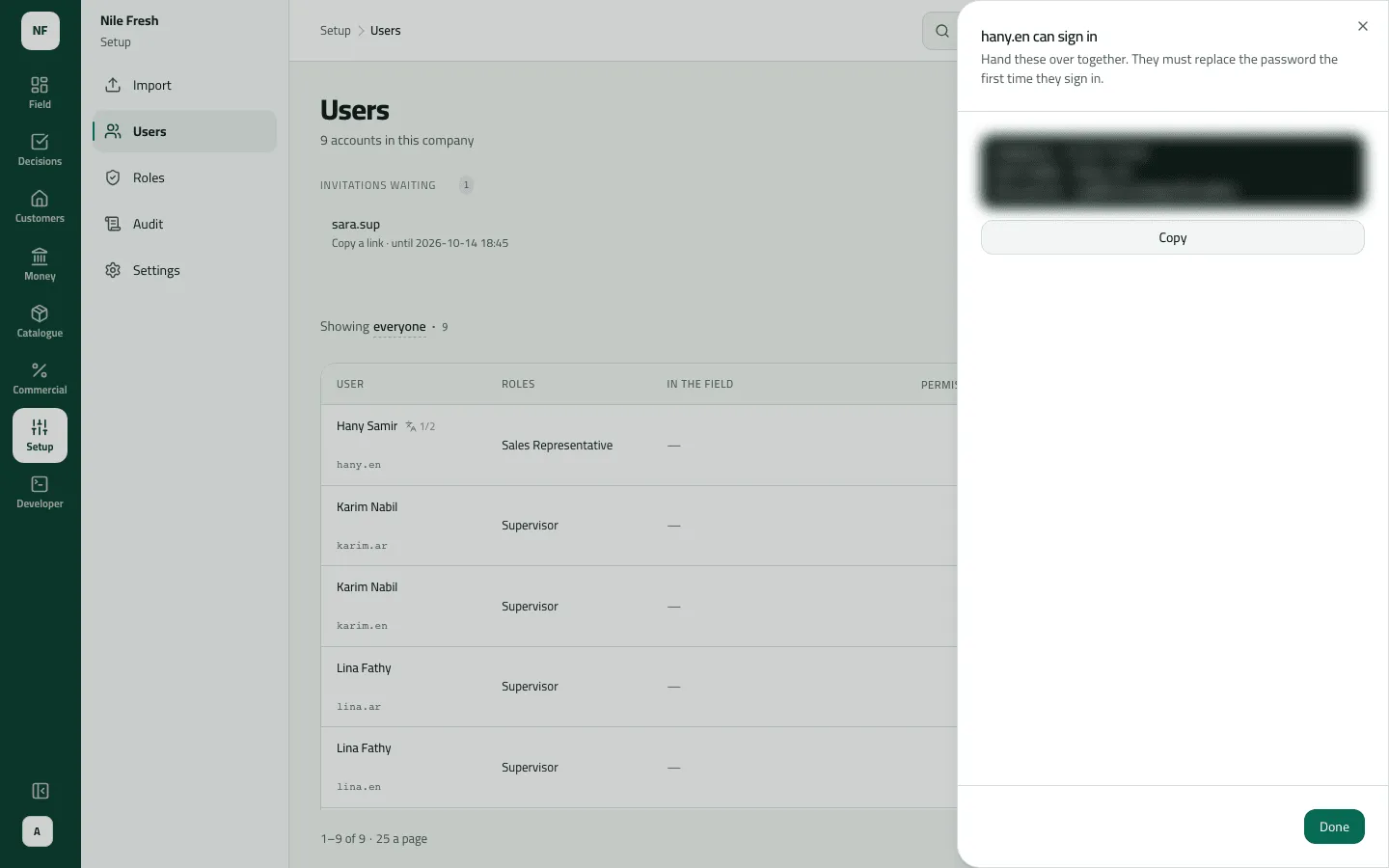 The hany.en can sign in sheet after inviting Hany Samir with a temporary password; the sign-in details are blurred, with a Copy button.